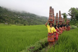 “Ullalim” harvest festival in Lubuagan, Kalinga as young ladies balance pots re-enacting in a dance how they fetch drinking water in the past.          
